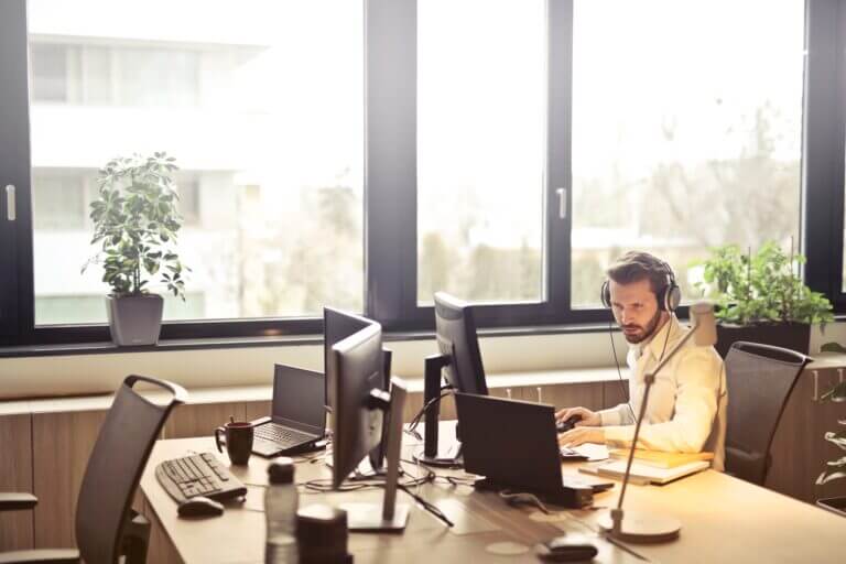 Man wearing headphones while working at a managed service provider