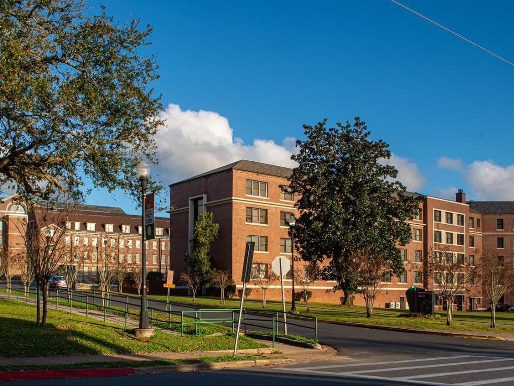 large brick dorm building on a college campus